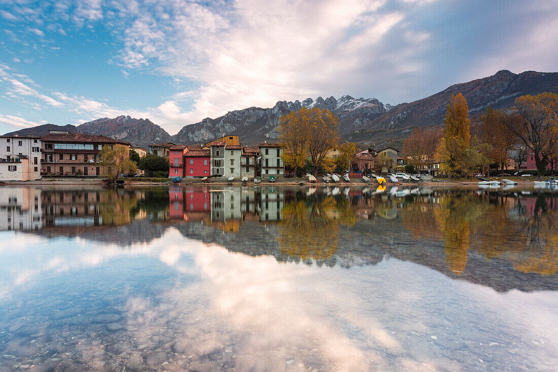 Pescarenico and Resegone mount reflected in the river Adda, Lecco, Lecco province, Lombardy, Italy