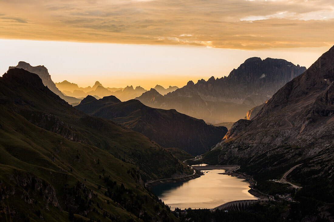 Fedaia lake at sunrise. Dolomites, Canazei, Trentino Alto Adige
