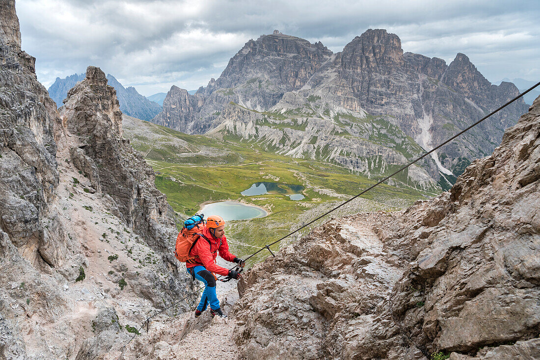 Sesto / Sexten, province of Bolzano, Dolomites, South Tyrol, Italy, Climber on the via ferrata 'De Luca-Innerkofler' to the Mount Paterno