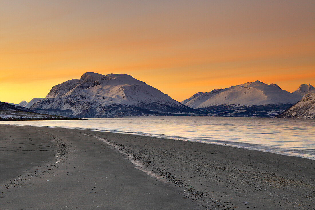 Panoramic view of the peaks overlooking the fjord. Nordmannvik, Kafjord, Lyngen Alps, Troms, Norway, Lapland, Europe.