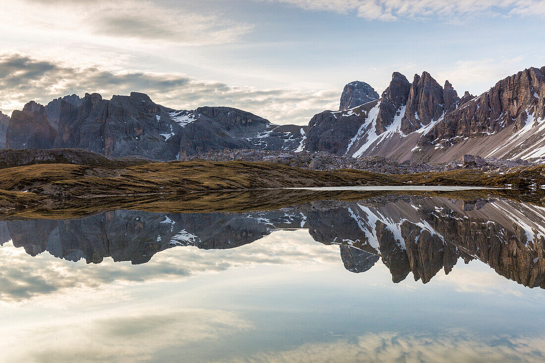 Rocky peaks reflected in Laghi Dei Piani, Dolomites, South Tyrol, province of Bolzano, Italy