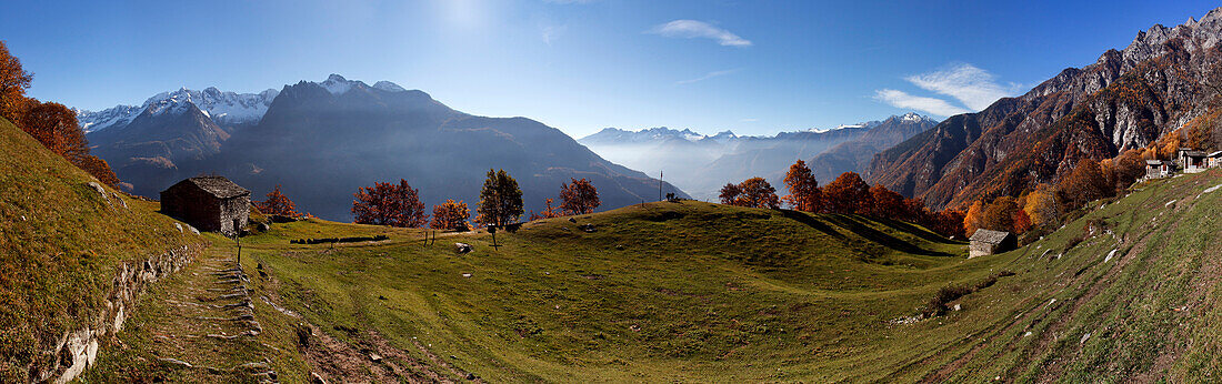 Panoramic picture of the village of Dasile in autumn, with Valchiavenna mountains in the background, Province of Sondrio, Lombardy, Italy