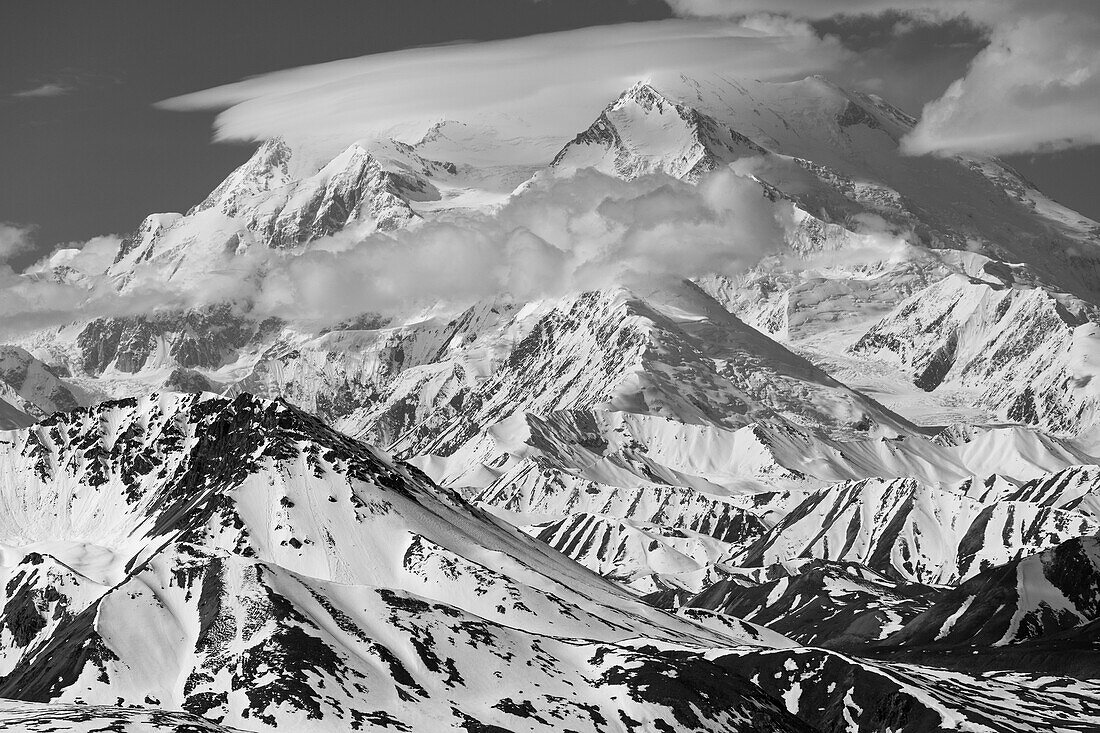 A 'cap cloud' covers the North and South Peak of Denali in early summer, viewed from Stony Dome in Denali National Park; Alaska, United States of America