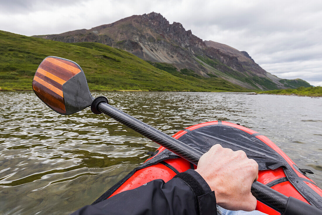 Point of view shot of paddling a pack raft on Landmark Gap Lake near the Denali Highway; Alaska, United States of America