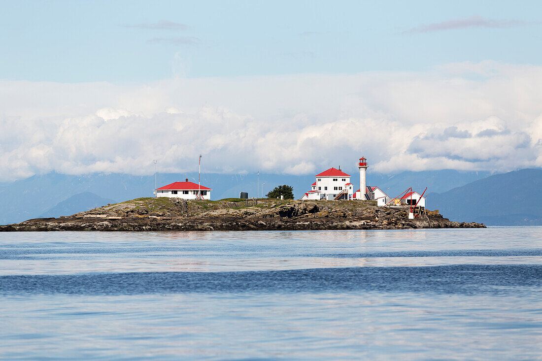 A manned lighthouse station on Entrance Island, near Nanaimo in the Georgia Straight, guides ferry traffic towards the harbour; Nanaimo, British Columbia, Canada
