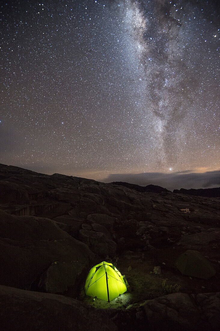 Tent under sky full of stars and milky way at camp in Sierra Nevada del Cocuy, Colombia