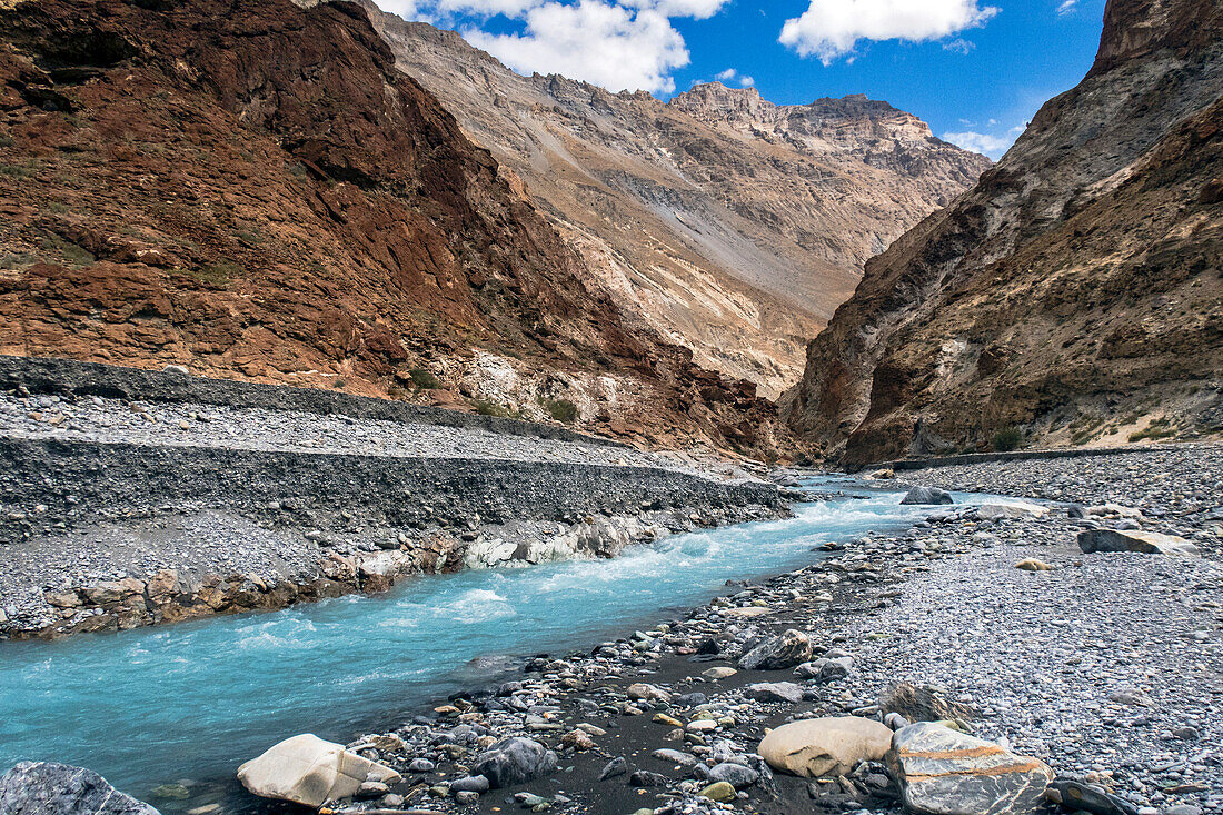 Majestic natural scenery with turquoise stream feeding into Zanskar River, Ladakh Region, Jammu and Kashmir, India