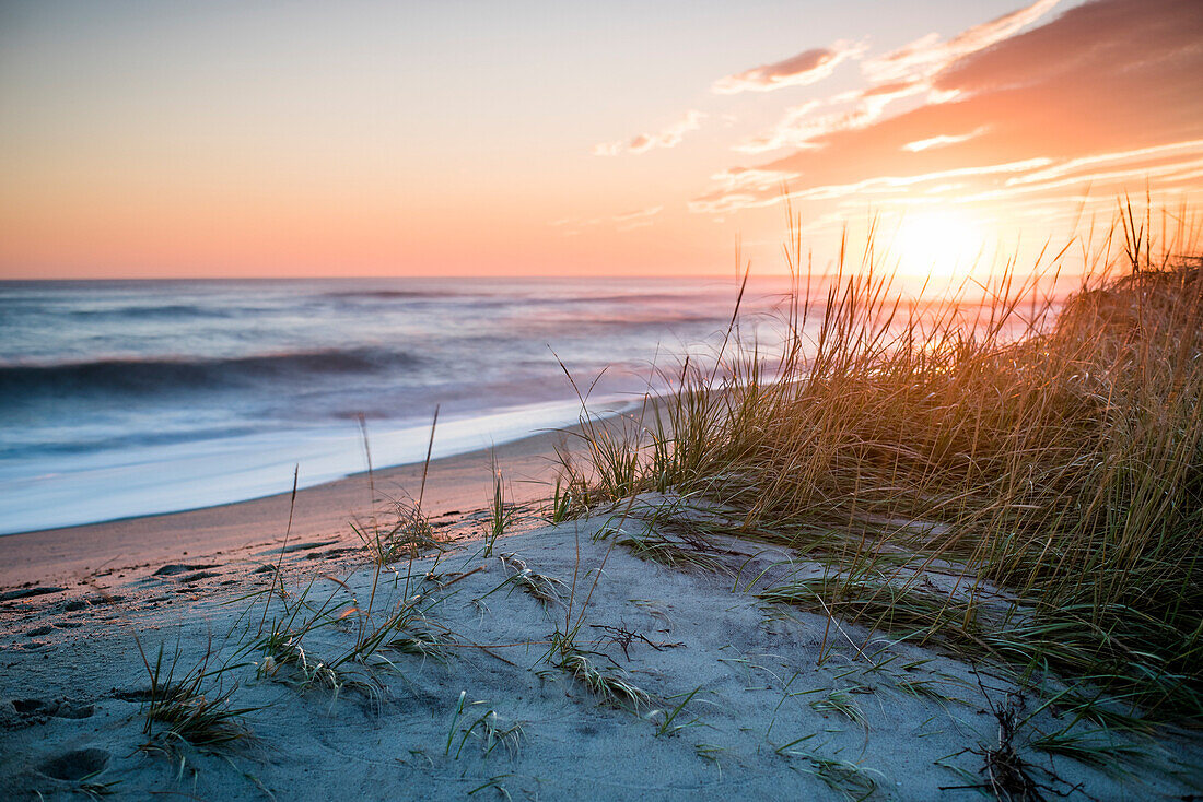Beach scenery at sunset under moody sky, Nantucket, Massachusetts, USA
