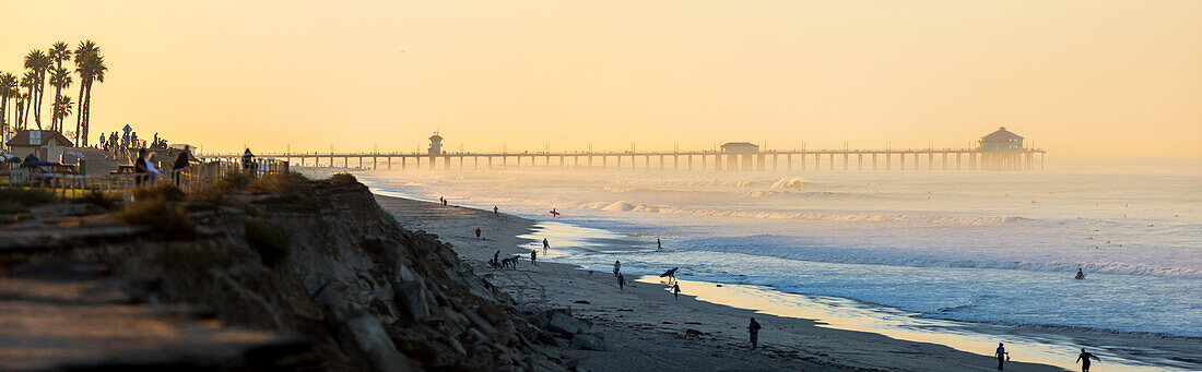 Panorama of Huntington Beach with pier in background at sunset, California, USA