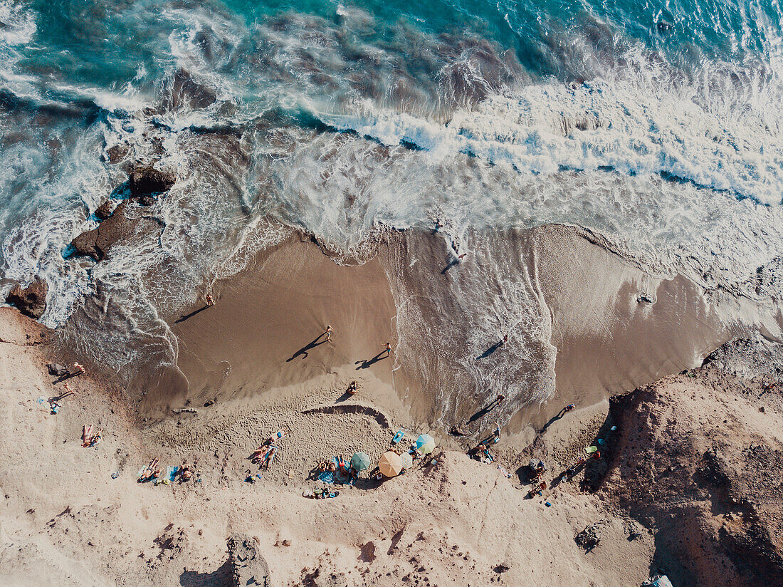 Aerial view of sandy beach with clear water and tourists, Tenerife, Canary Islands, Spain