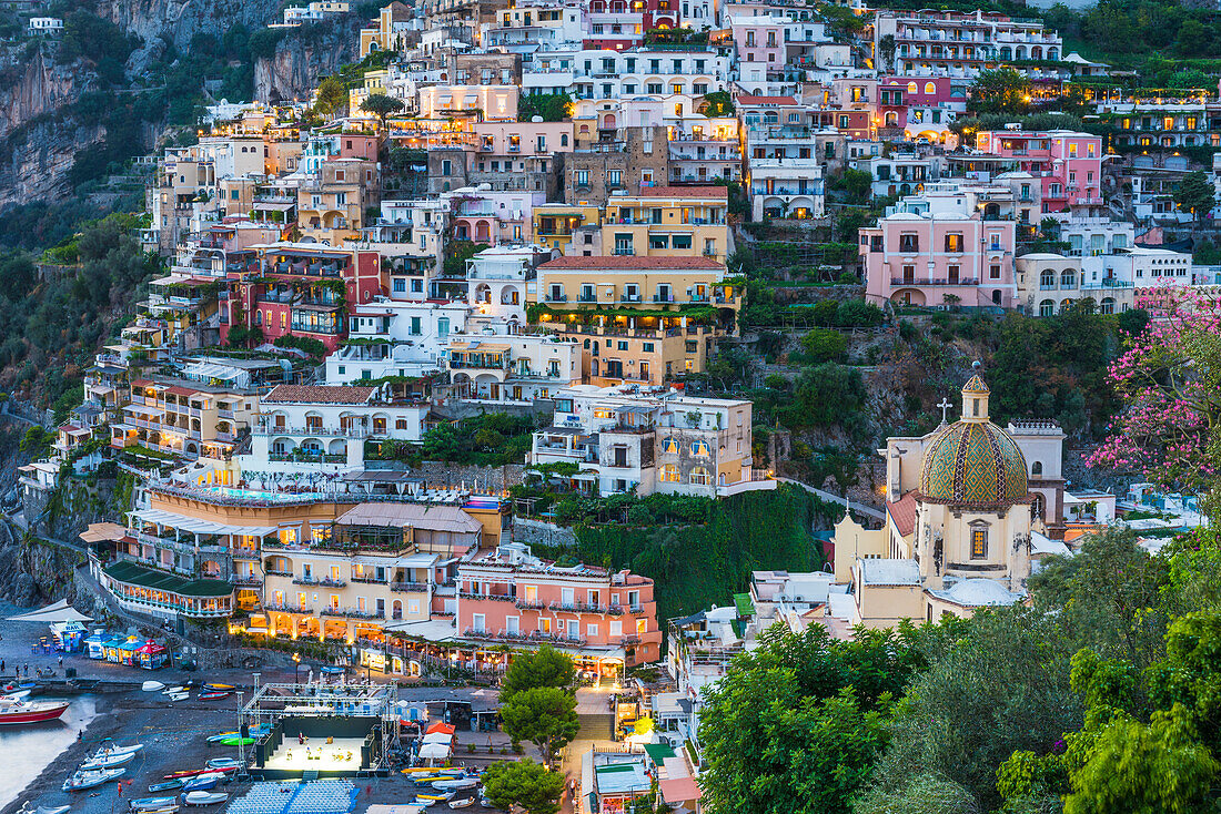 Positano, Salerno Province, Campania, Italy. View of the center of Positano at dusk