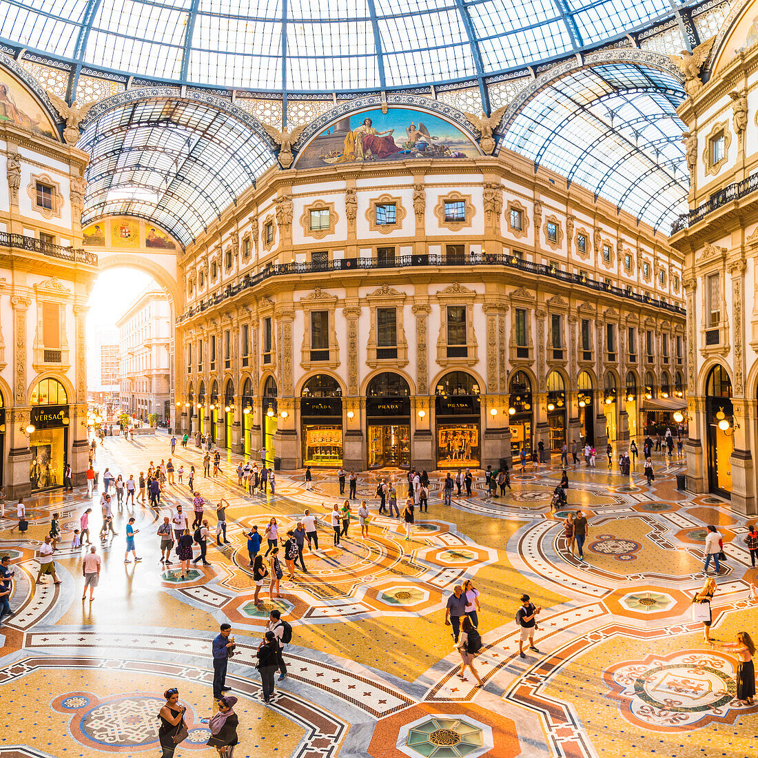 Galleria Vittorio Emanuele II, Milan, Lombardy, Italy. Tourists walking in the world's oldest shopping mall.