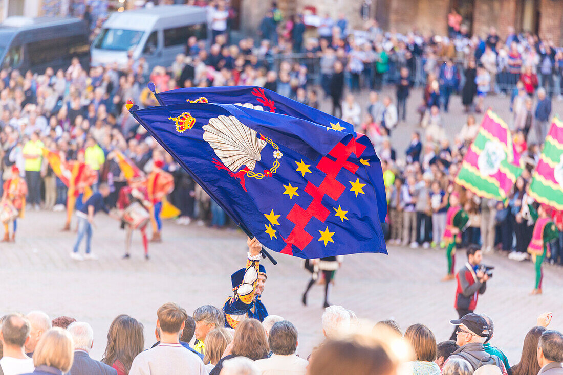 Typical exhibition of traditional clothes and flags of the different contradas Piazza del Campo Siena Tuscany Italy Europe