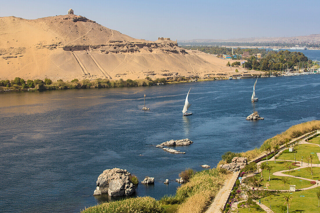 View of River Nile, Tombs of the Nobles on the West Bank, Elephantine Island, and the gardens of the Movenpick Resort, Aswan, Upper Egypt, North Africa, Africa
