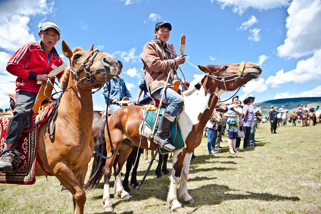 Horses and young horsemen on their mark for this years 20 kms bareback horse race during annual Naadam Festival, Bunkhan, Bulgam, Mongolia, Central Asia, Asia