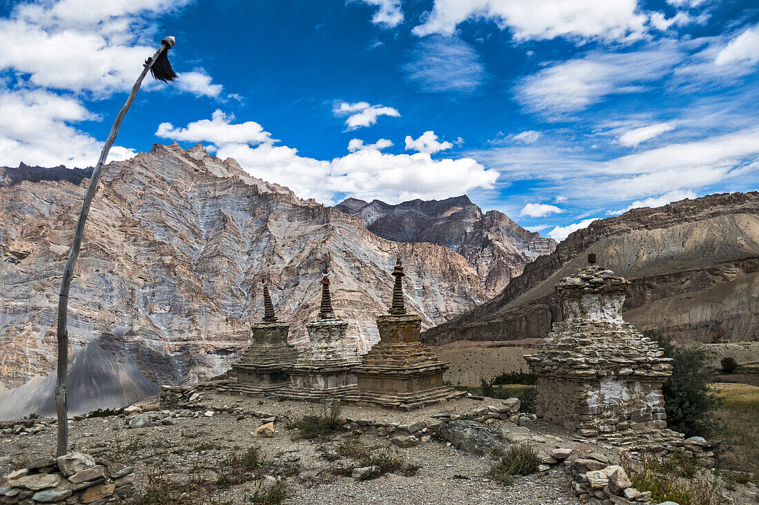 Weathered Buddhist chortens at Neyrak village looking over cliff, Zanskar, India, Himalayas, Asia