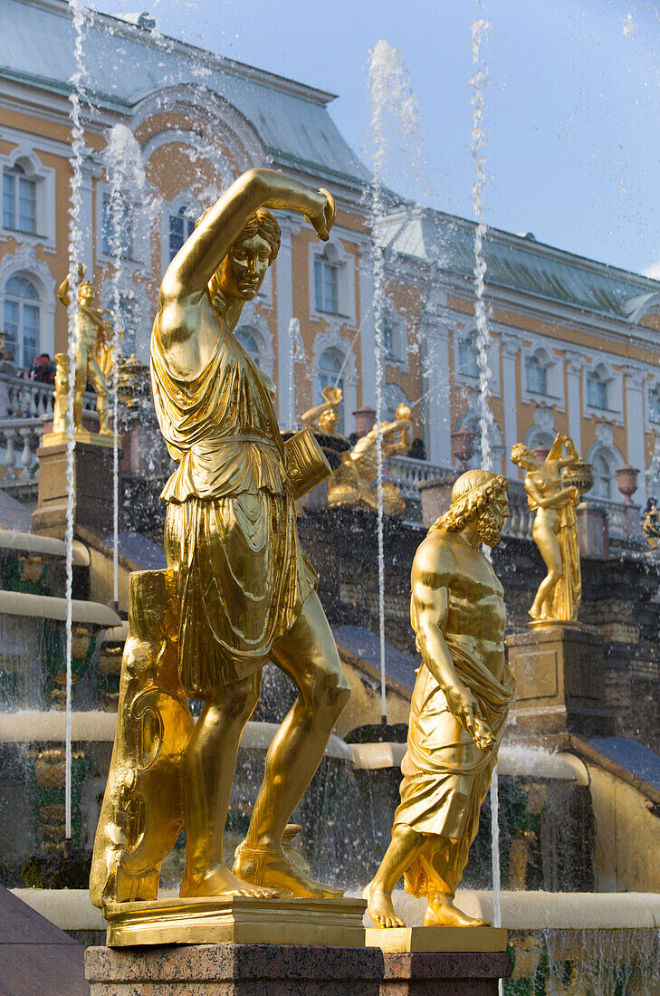 Statue of Jupiter to left in foreground, Great Cascade in the background, Peterhof, UNESCO World Heritage Site, near St. Petersburg, Russia, Europe