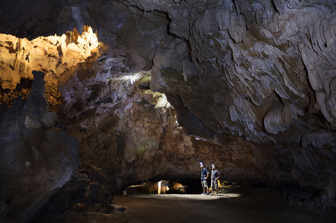 Hikers in the interior of Galaxy cave on the Ben Dang River in Thien Ha, Ninh Binh, Vietnam, Indochina, Southeast Asia, Asia