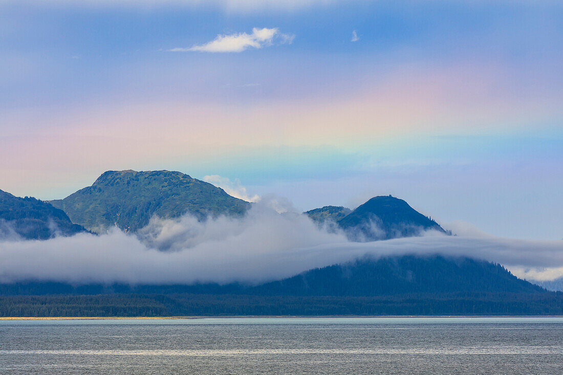 Rainbow colours and low hanging mist over Icy Strait, between Chichagof Island and Glacier Bay National Park, UNESCO World Heritage Site, Alaska, United States of America, North America