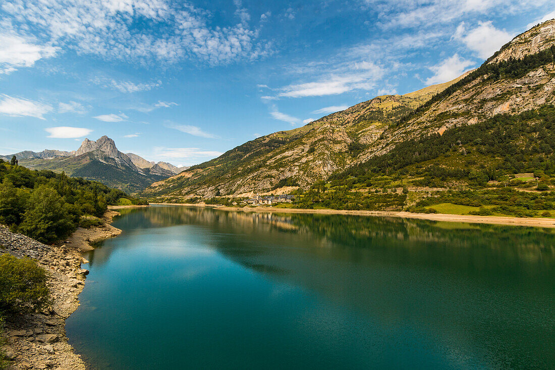Lanuza lake and village and Pena Foratata peak in the scenic upper Tena Valley, Sallent de Gallego, Pyrenees, Huesca Province, Spain, Europe