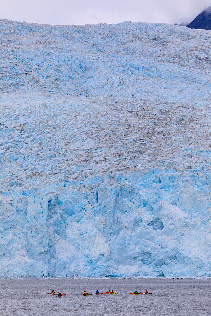 Colourful kayaks, Aialik Glacier, blue ice, Harding Icefield, Kenai Fjords National Park, near Seward, Alaska, United States of America, North America