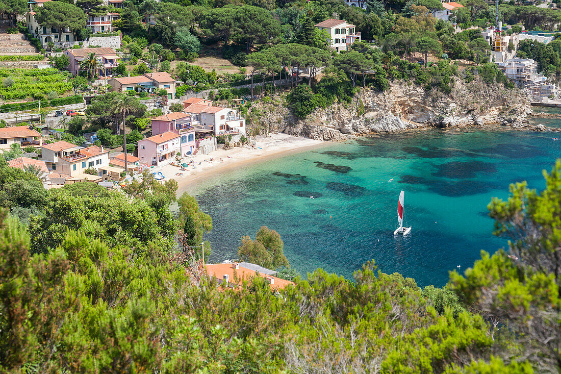 Sailboat in the turquoise sea, Porto Azzurro, Elba Island, Livorno Province, Tuscany, Italy, Europe
