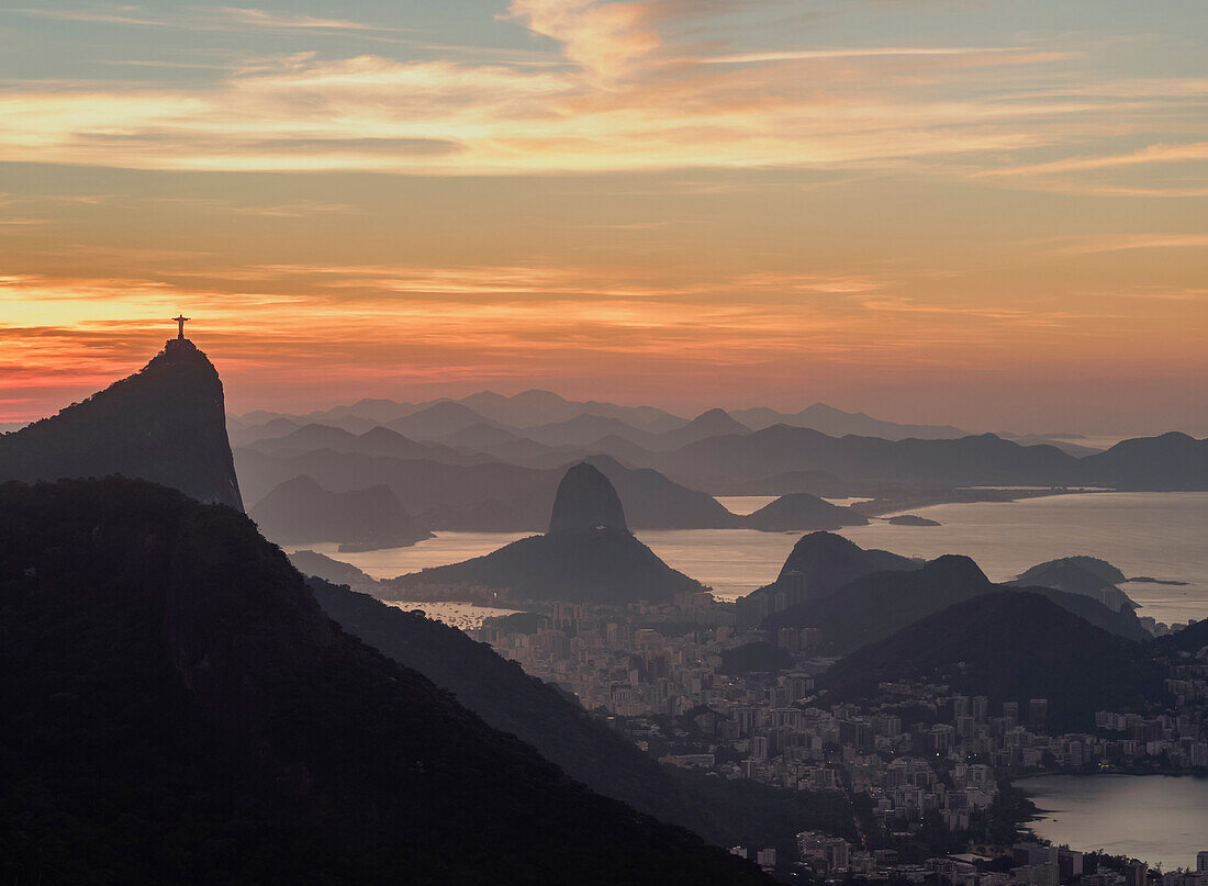 View towards Corcovado and Sugarloaf Mountains from Tijuca Forest National Park at dawn, Rio de Janeiro, Brazil, South America