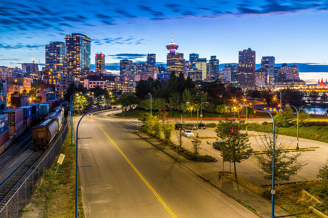 View of city skyline and Vancouver Lookout Tower at dusk from Portside, Vancouver, British Columbia, Canada, North America