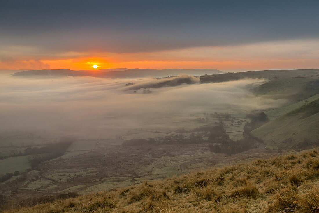 View from Mam Tor of fog in Hope Valley at sunrise, Castleton, Peak District National Park, Derbyshire, England, United Kingdom, Europe