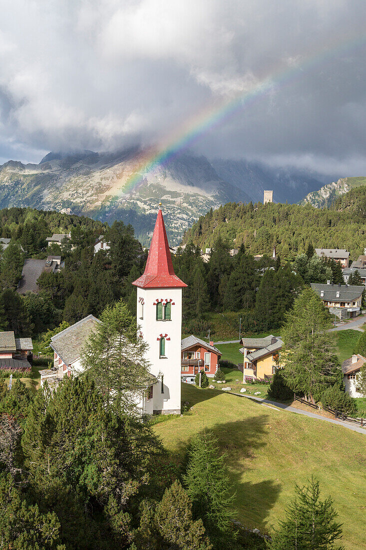 Rainbow over Chiesa Bianca, Maloja, Bregaglia Valley, Engadine, Canton of Graubunden (Grisons), Switzerland, Europe