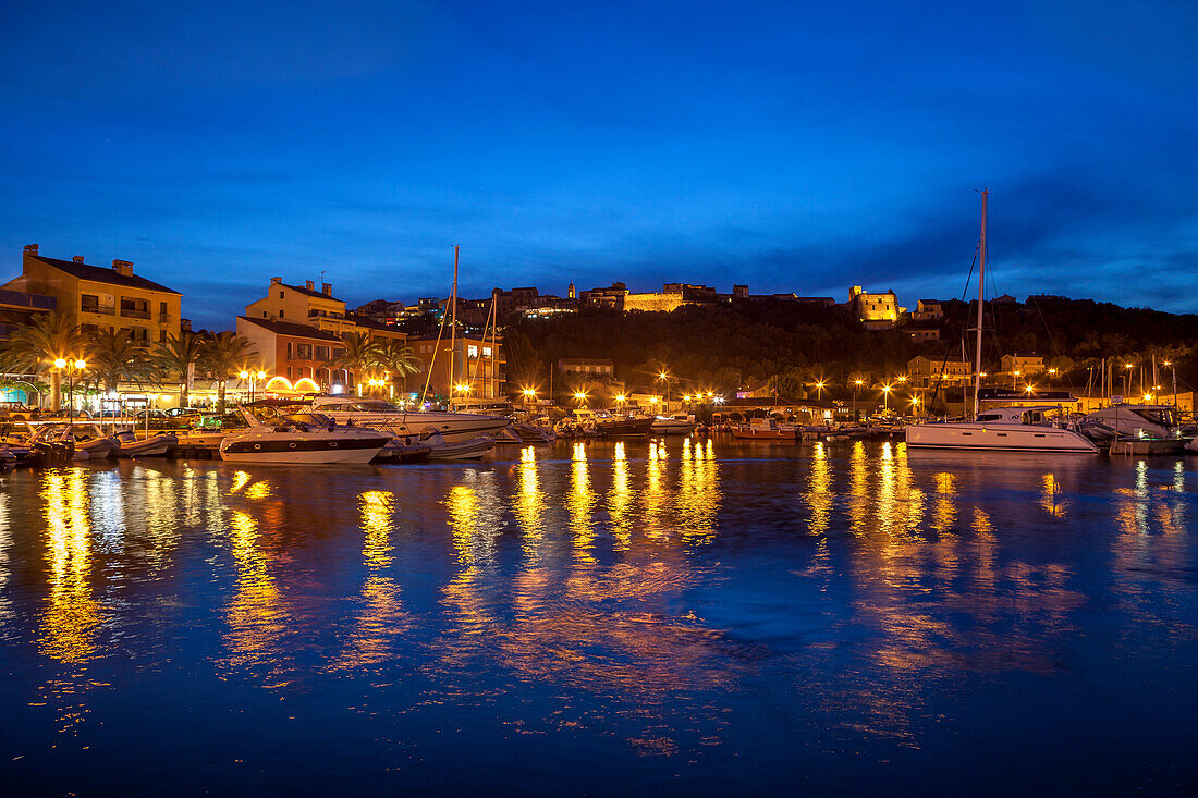 Harbour lit up at dusk, Porto Vecchio, Corsica, France, Mediterranean, Europe