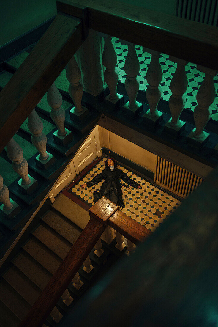 Caucasian woman laying on staircase