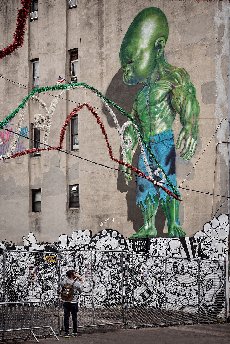 Hipster taking a photo of huge Hulk mural, Little Italy, Manhattan, NYC, New York City, United States of America, USA, North America