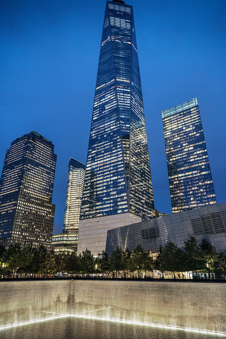 One World Trade Center tower and base basin of the collapsed 9/11 World Trade Center at night, WTC Memorial, Manhattan, NYC, New York City, United States of America, USA, North America