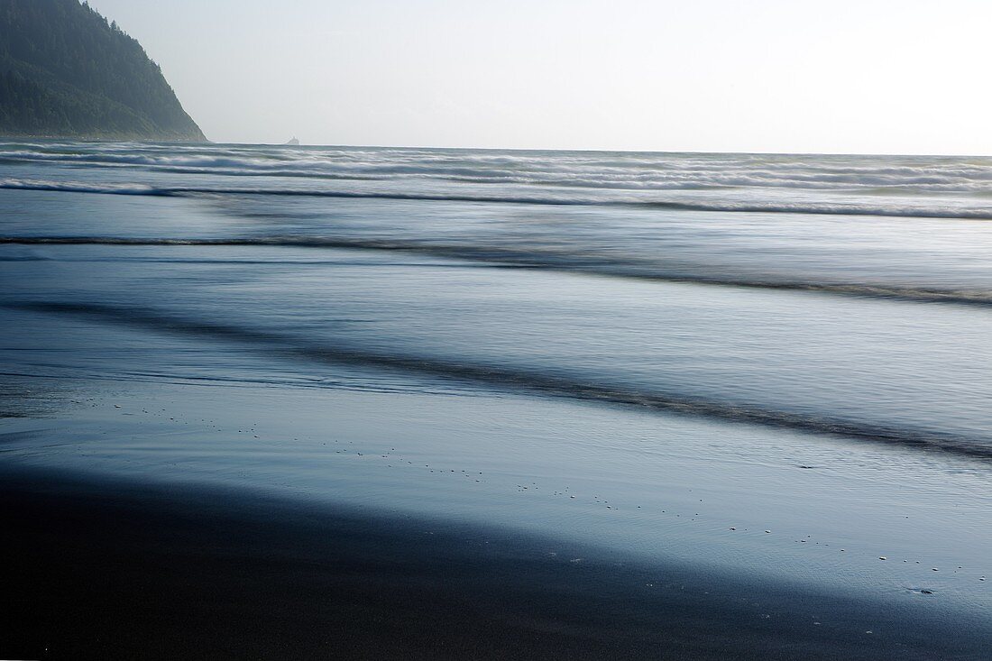 Rising tide along the Oregon Coast creates layers of waves coming to shore.