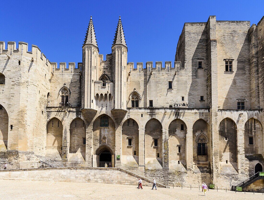 Gothic twin towered facade of the Palais Neuf, Palais des Papes, Palace Square, Avignon, Vaucluse, Provence-Alpes-Cote d'Azur, France.