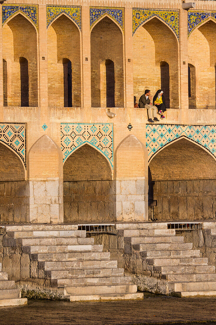 Couple at Chadschu bridge of Esfahan, Iran, Asia