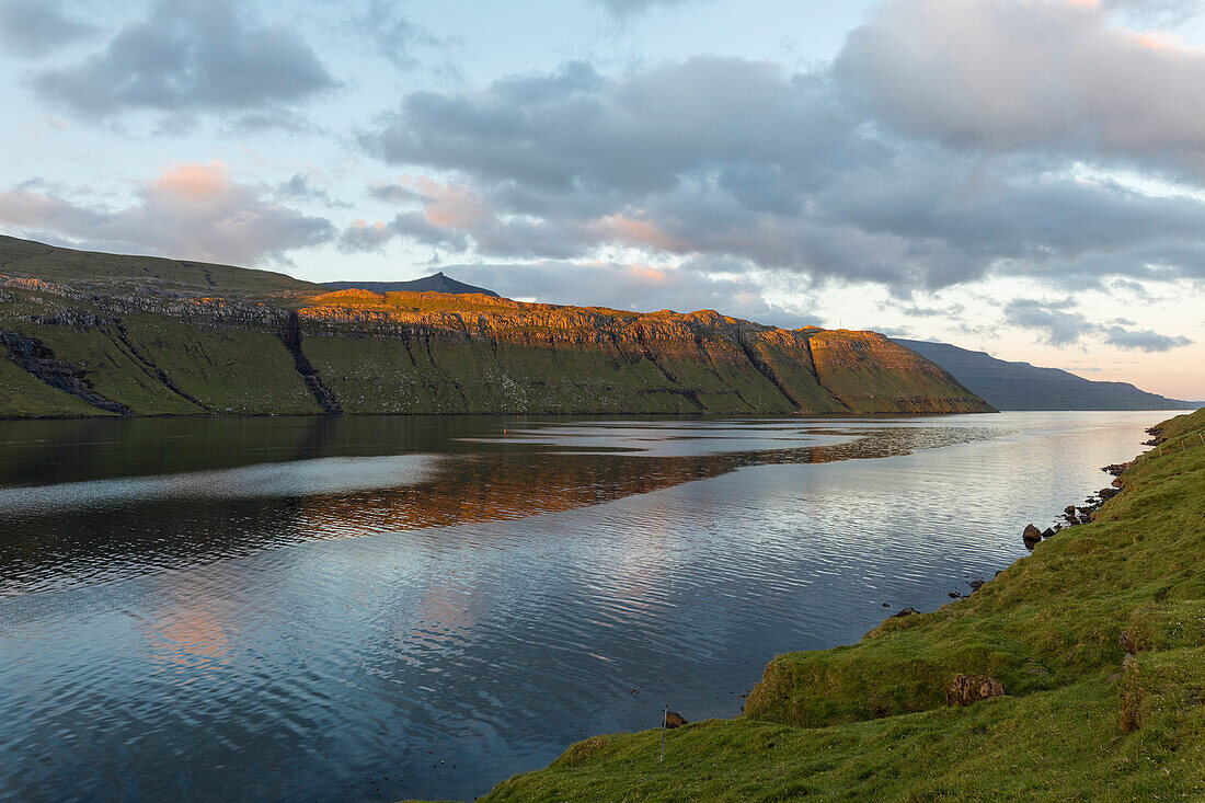 Sunset on fjord and sea, Eidi, Eysturoy Island, Faroe Islands, Denmark, Europe
