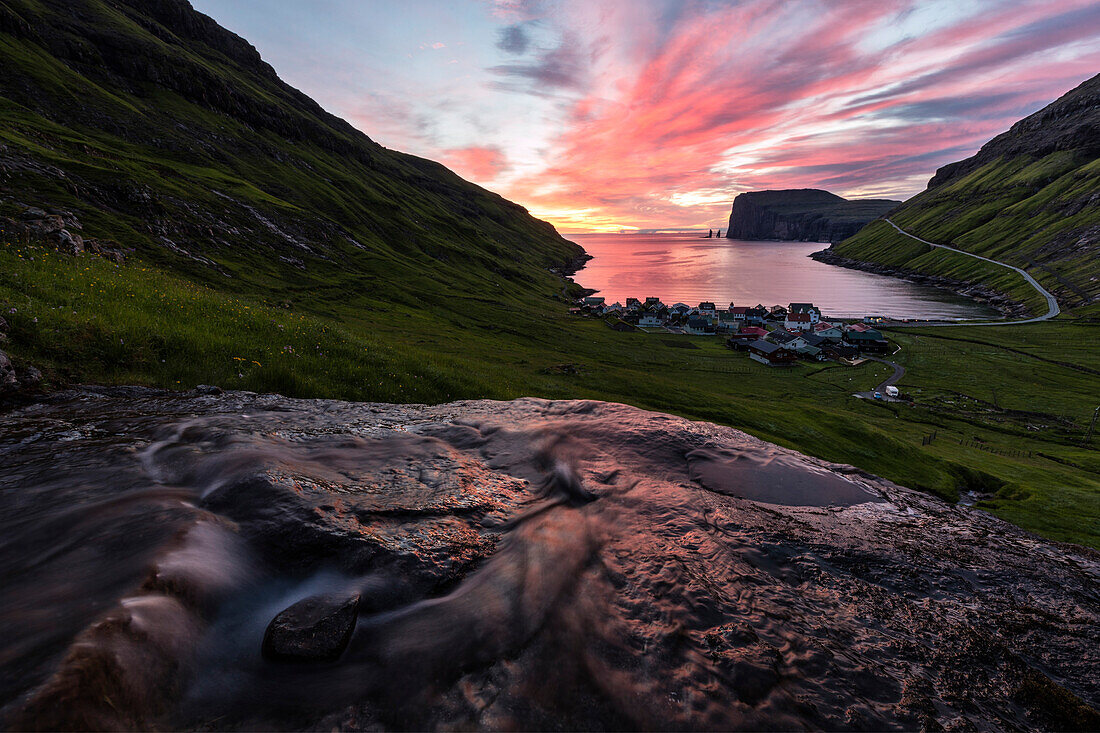 Water of creek flows on rocks, Tjornuvik, Sunda Municipality, Streymoy Island, Faroe Islands, Denmark, Europe