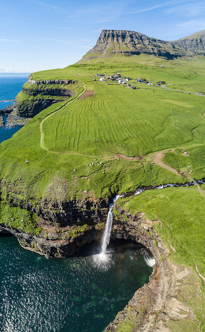 Panoramic of cliffs and Mulafossur Waterfall, Gasadalur, Vagar Island, Faroe Islands, Denmark, Europe