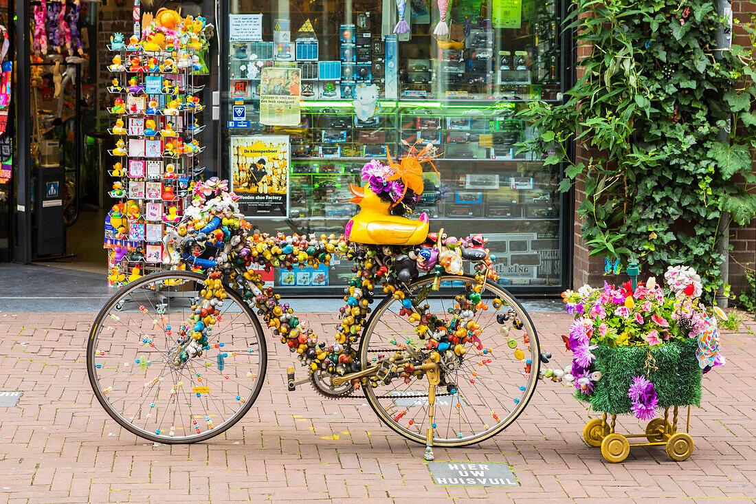 A bicycle outside a shop in Amsterdam, Netherlands, Europe