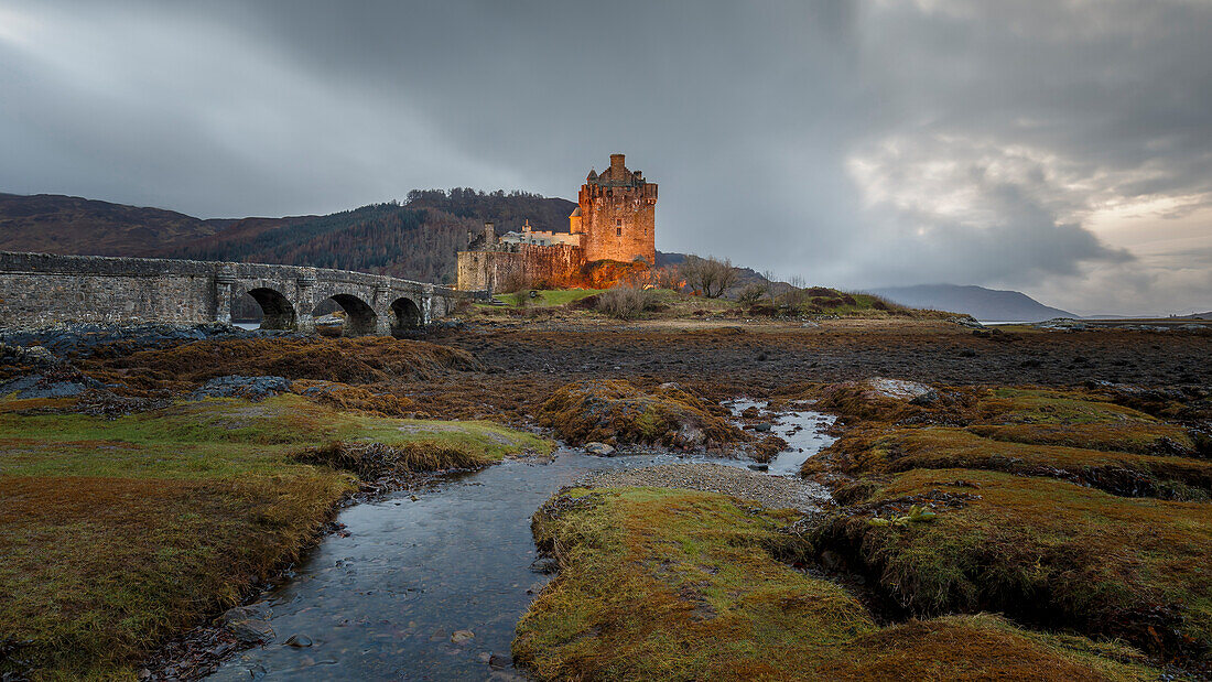 Dusk at Eilean Donan (Eilean Donnan) Castle in Dornie, Highlands, Scotland, United Kingdom, Europe