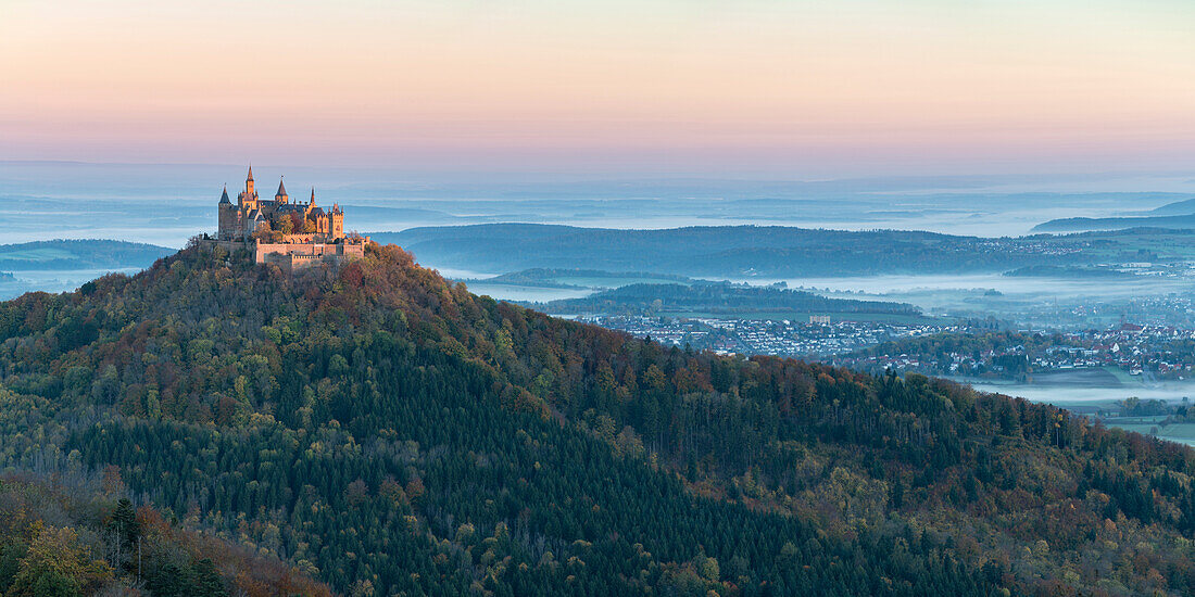 Hohenzollern Castle in autumnal scenery at dawn, Hechingen, Baden-Wurttemberg, Germany, Europe