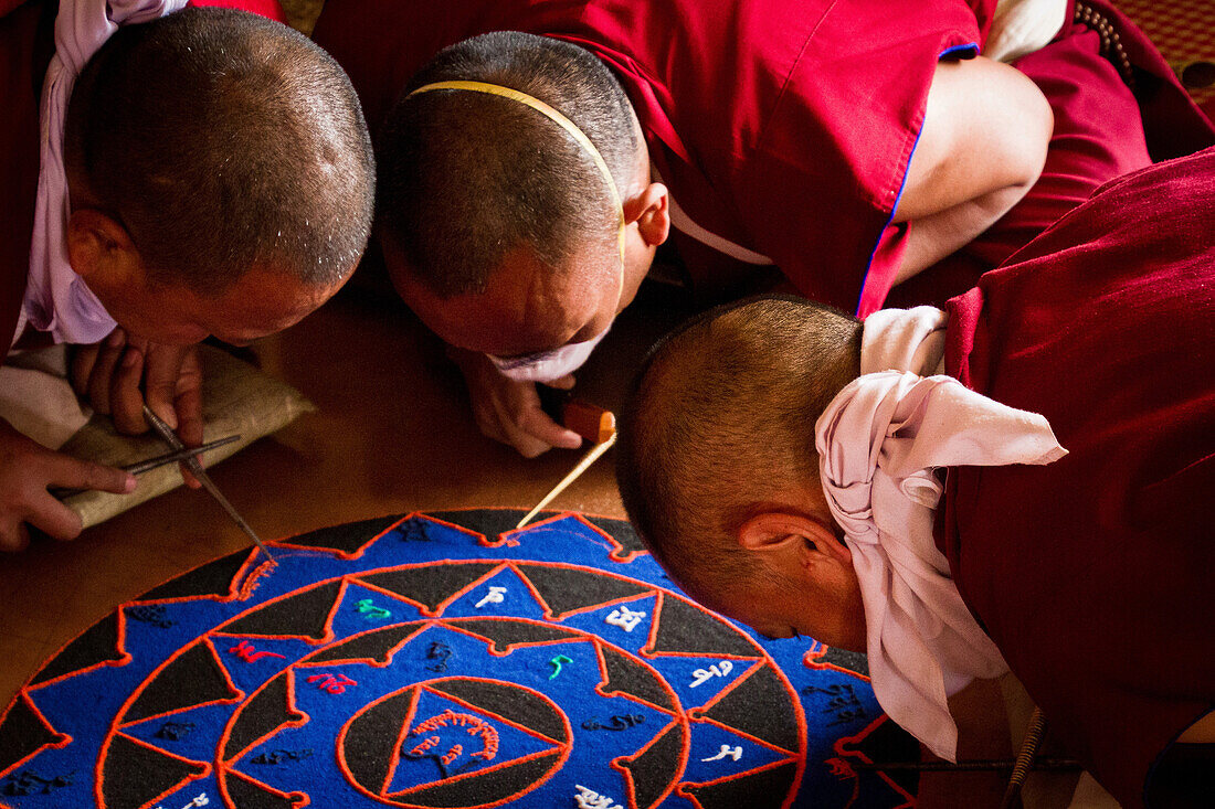 Buddhist monks of the yellow hat tradition making a sand mandala, Gyuto Tantric Monastery, Dharamsala, Himachal Pradesh, India, Asia