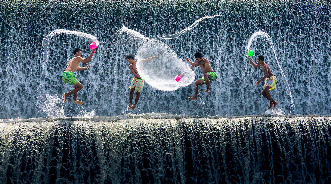 Boys water fight, Tukad Unda dam, Bali, Indonesia, Southeast Asia, Asia