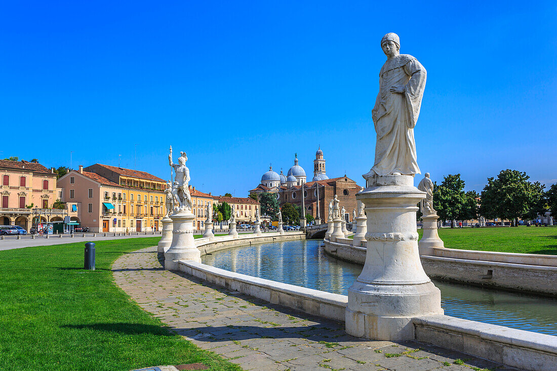View of statues in Prato della Valle and Santa Giustina Basilica visible in background, Padua, Veneto, Italy, Europe