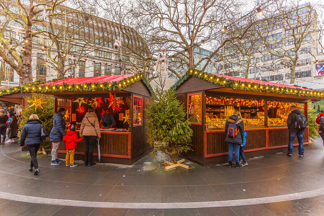 Christmas Market Stalls and William Shakespeare Fountain in Leicester Square, London, England, United Kingdom, Europe