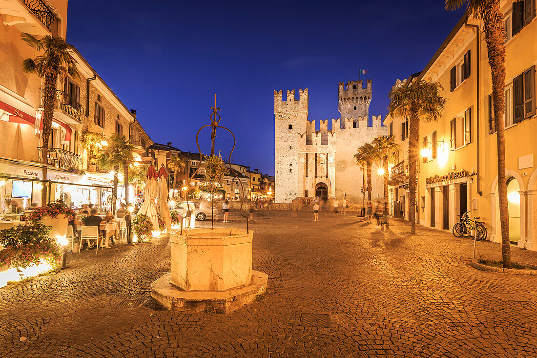 View of Scaliger Castle and Piazza Castello illuminated at night, Sirmione, Lake Garda, Lombardy, Italian Lakes, Italy, Europe