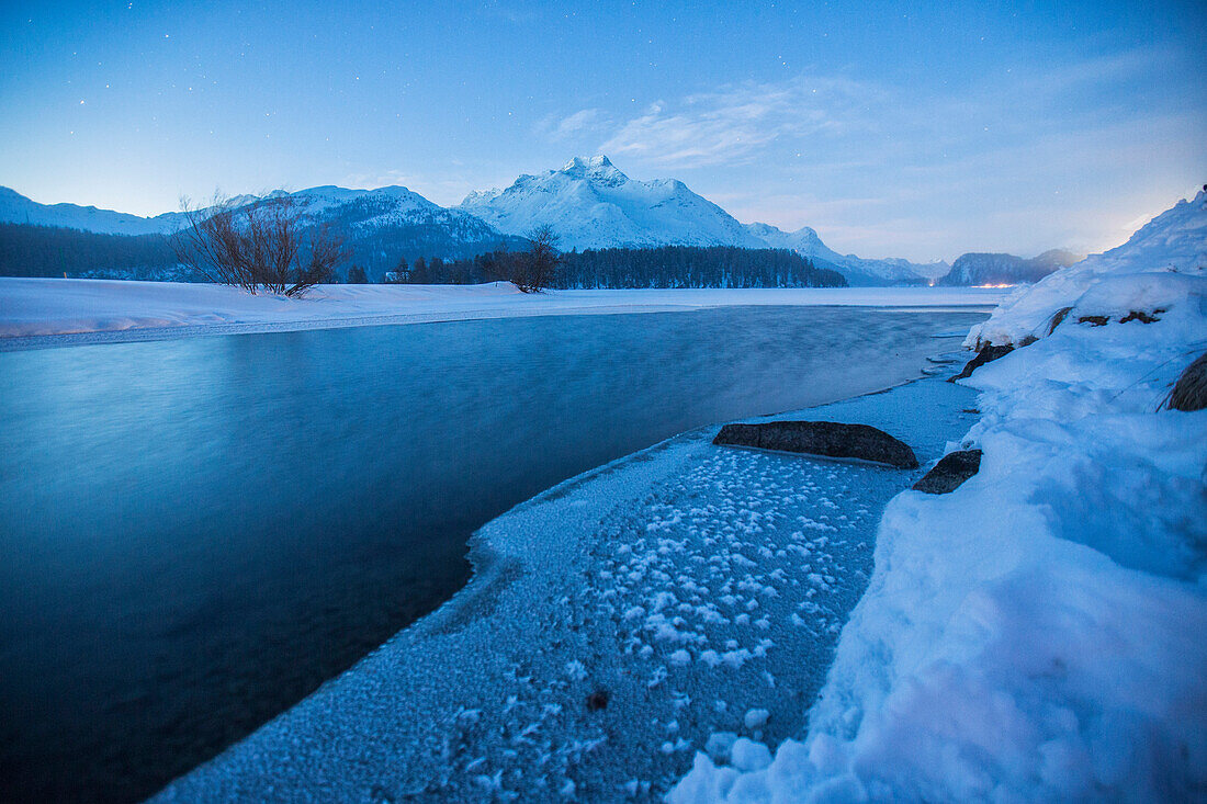 Piz Da La Margna and icy Lake Sils, Maloja, Engadine, Canton of Graubunden, Switzerland, Europe