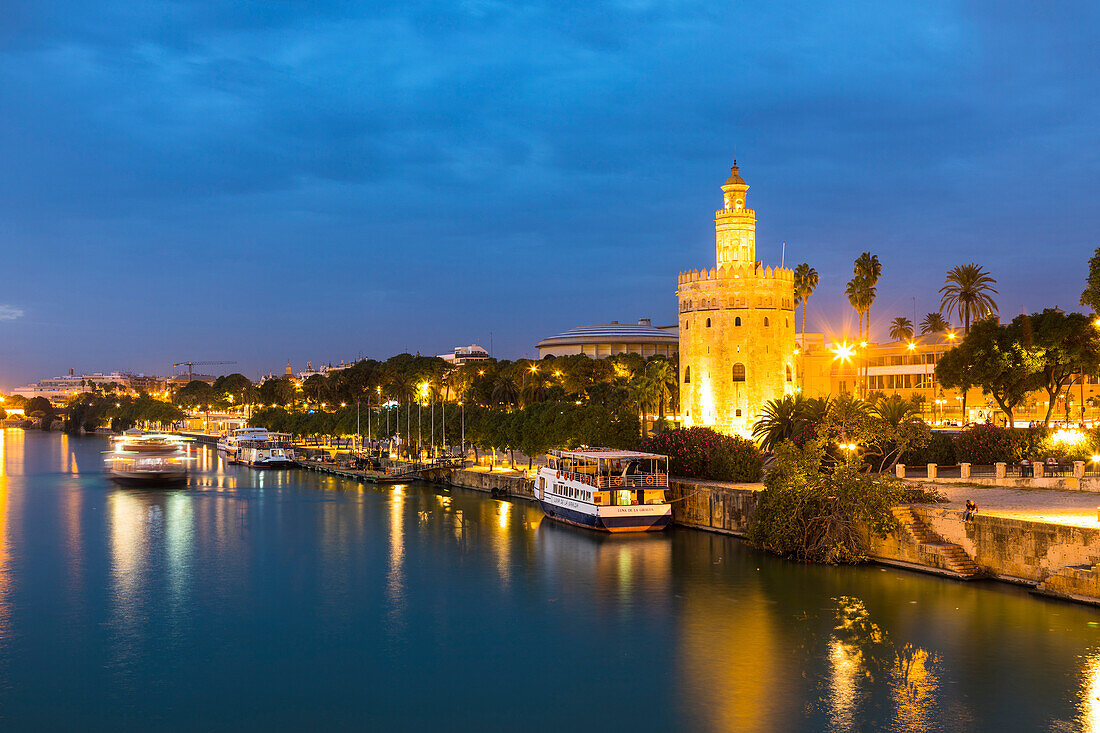 Torre del Oro (Gold Tower) and river Rio Guadalquivir at night, Seville, Andalusia, Spain, Europe